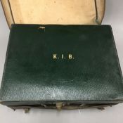 An Asprey & Co leather travelling case containing silver mounted fittings