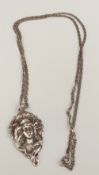 An Art Nouveau style silver pendant on chain (24.