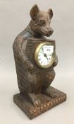 A wooden carved bear clock