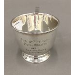 A silver presentation cup (3.