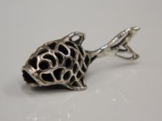 A silver pin cushion formed as a fish