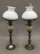 A pair of Victorian silver plated oil lamps