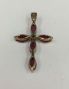 A 9 ct gold diamond and ruby crucifix (0.