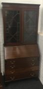 An Edwardian bureau bookcase