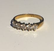 An 18 ct gold five stone diamond ring