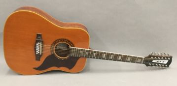 An Italian EKO 12 string guitar, the interior with label signed by George Harrison,