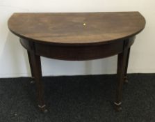 A 19th century mahogany demi lune side table