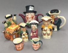 A quantity of character jugs and novelty teapots,