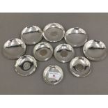 A quantity of small Chinese sterling silver coin set dishes and other unmarked small dishes (14 .