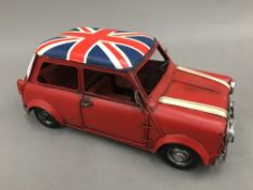 A tin plated model of a Mini Cooper