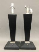 A pair of Art Deco style black lamps