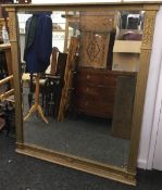 A Victorian gilt framed over mantle mirror. 125 x 141 cm including frame.