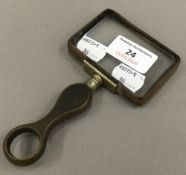 A horn handled magnifying glass