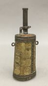 A 19th century Tibetan carved horn powder flask