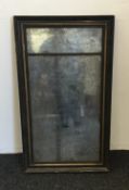 A 19th century ebonised mirror