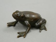 A Japanese bronze model of a frog