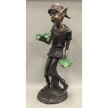 A bronze model of a pixie