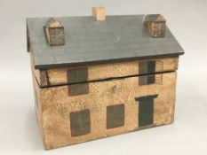 A tea caddy formed as a house