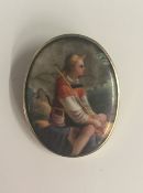 A Victorian painted porcelain brooch