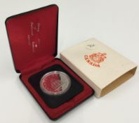 A silver proof Canadian dollar,