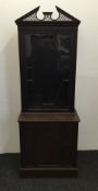 An Edwardian glazed mahogany side cabinet