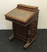 A Victorian walnut davenport