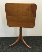 A 19th century satin walnut tilt top tripod table