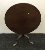 A George III mahogany tilt top tripod table