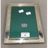 A boxed silver photograph frame. 22 x 17 cm.