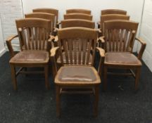 Ten early 20th century leather seated oak open armchairs