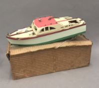 A vintage boxed model motorboat