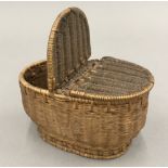A vintage miniature wicker creel basket