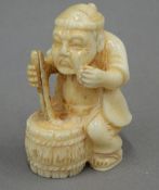 A carved bone netsuke