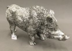 A silver coloured model of a wild boar