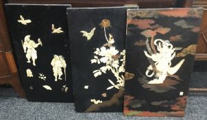 Three 19th century Japanese bone and ivory inlaid lacquered plaques