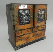 A late 19th century Japanese lacquered table cabinet