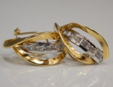 A pair of 18 ct yellow and white gold set earrings (3.