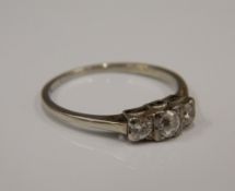 An 18 ct white gold three stone diamond ring (1.