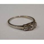 An 18 ct white gold three stone diamond ring (1.