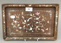 A Chinese mother-of-pearl inlaid wooden panel