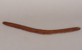 A vintage Australian carved wooden boomerang, of typical form. 50.5 cm long.