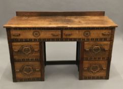 An early 20th century carved oak dressing table
