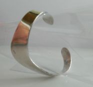 A silver cuff bangle (29.