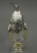 A silver plated sugar sifter formed as a penguin