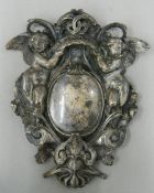 A white metal armorial casting