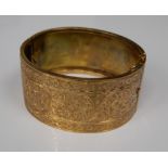 A 9 ct gold cuff bangle (22.