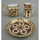 Two Royal Crown Derby jugs and a saucer