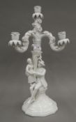 A Continental blanc-de-chine figural candelabra