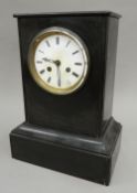 A Victorian black slate mantel clock