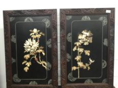 A pair of 19th century Japanese bone and ivory floral plaques